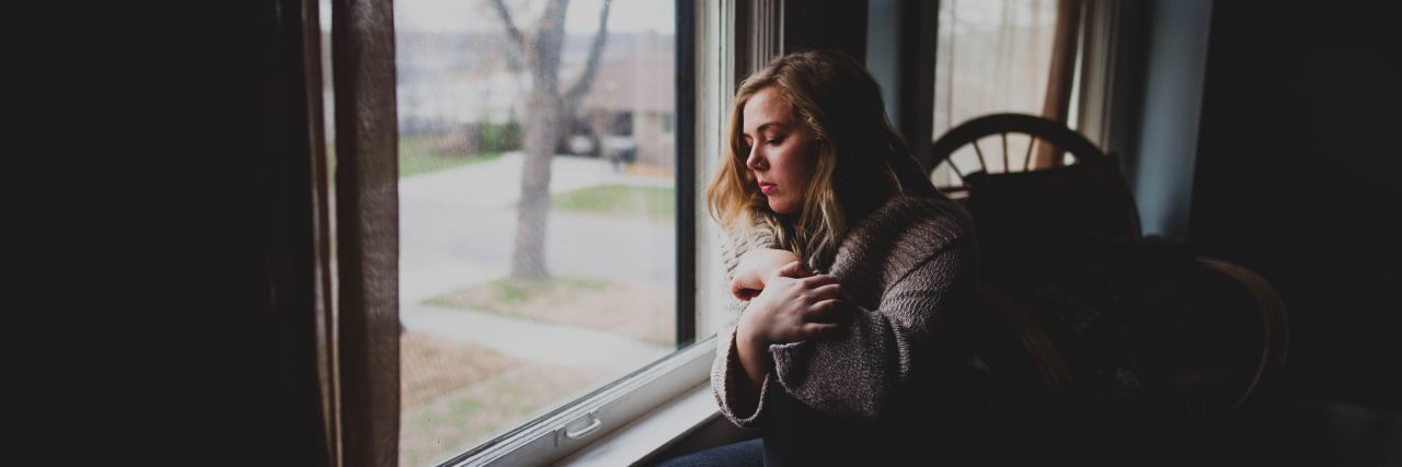 5 Ways I Fight Eating Disorder ‘Recovery Fatigue’ girl sitting by window during the fall