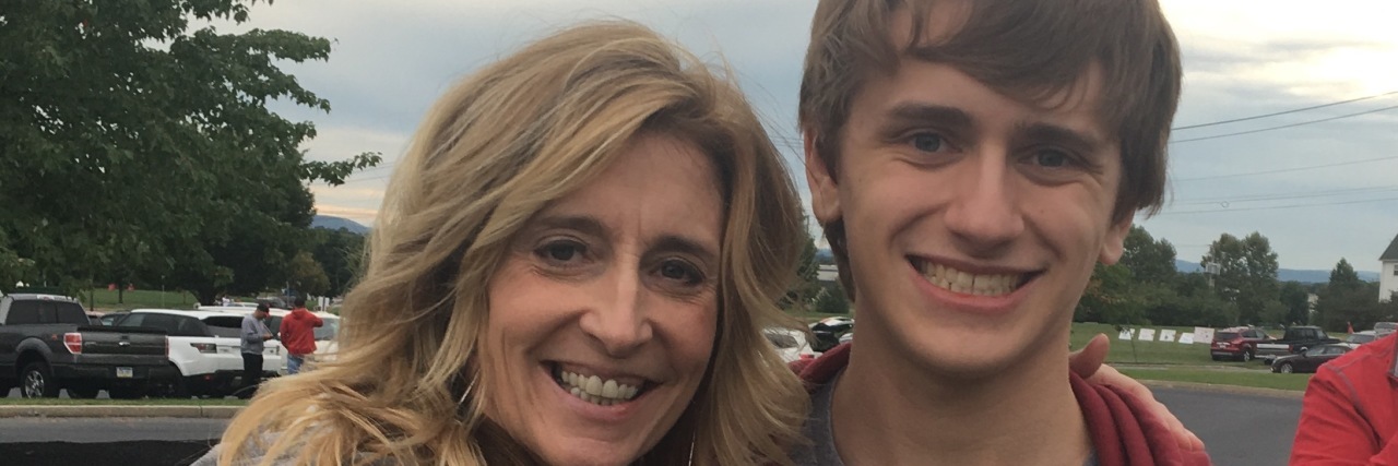 Trying to Land the Helicopter as a Parent to a Child With Autism Mother and teenage son hugging side by side