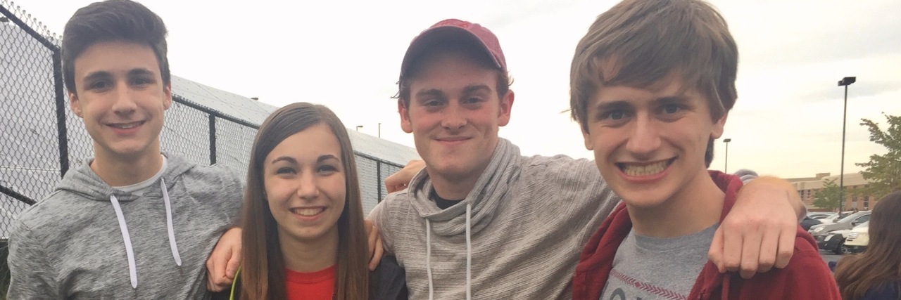 Understanding Teens With Autism Ryan smiling at camera along with three friends