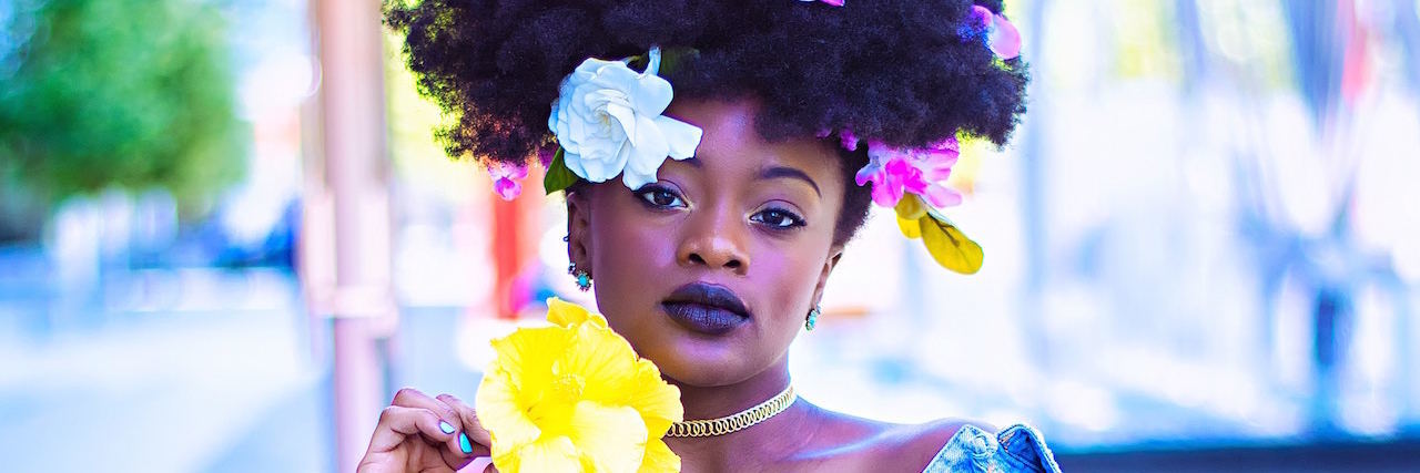 When Mental Illness Makes You Feel Unlovable A black woman with flowers in her hair