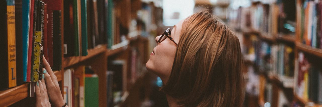 14 Tips on Surviving College With Anxiety girl in library at college