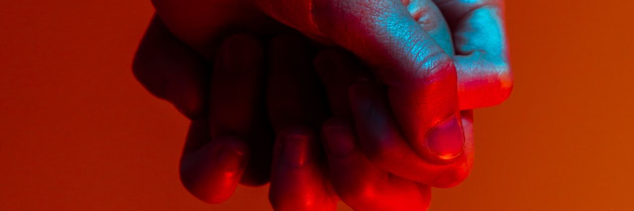 To the Partner Who Has Supported Me Through Eating Disorder Recovery holding hands with red background