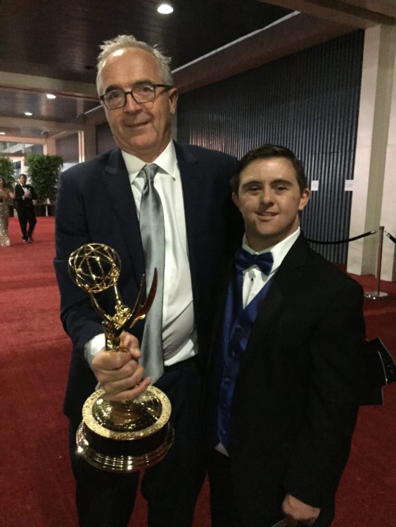 Sean McElwee with show creator holding Emmy