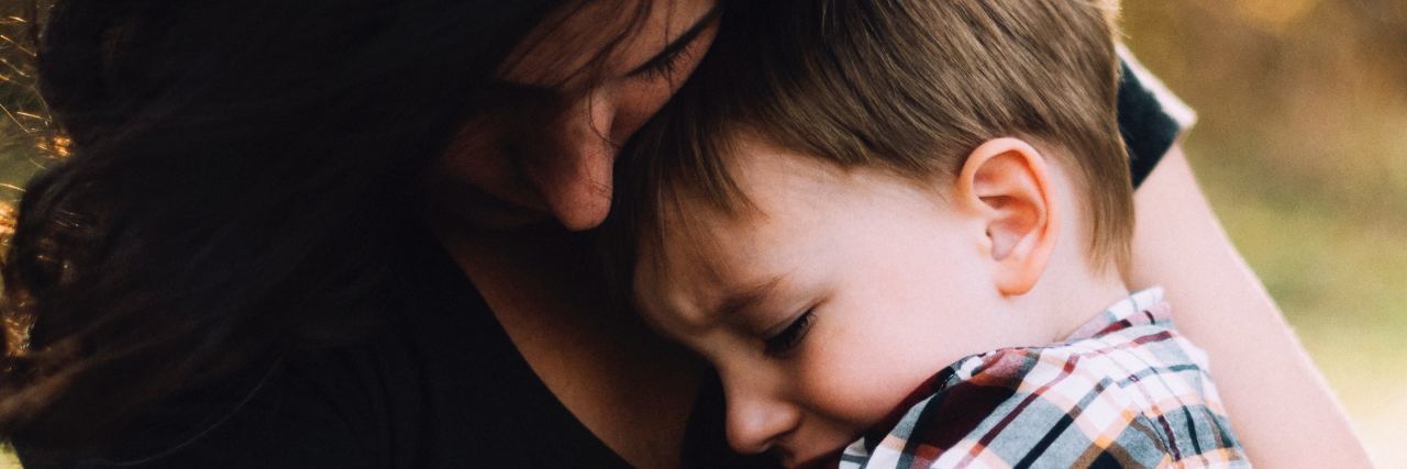 What I Wish You Knew About My Son With Obsessive Compulsive Disorder mom holds son in her arms