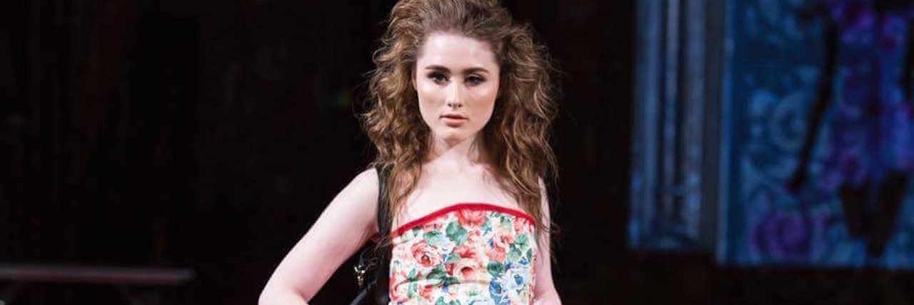 What It Was Like Being the First Tube-Fed Model to Walk in NYFW mellie white on the runway
