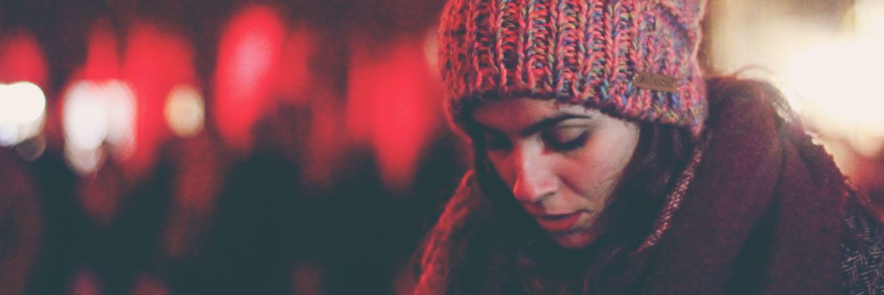 How You Might Be Invalidating a Loved One's PTSD young woman alone unfocused background looking sad