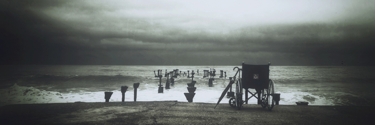 Beach scene with wheelchair.