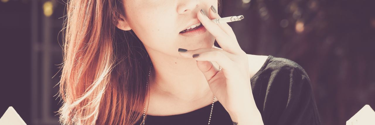 Smoking Made My Mental Health Struggles Worse woman smoking