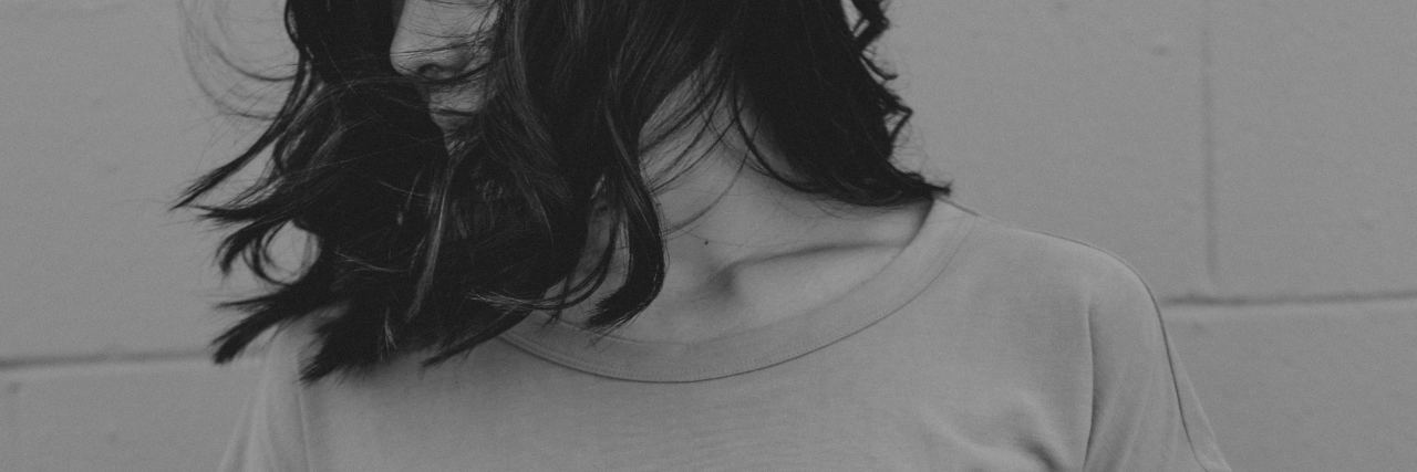 What I Need as an 'Extroverted Introvert' Struggling With Anxiety a woman with short dark hair looks to the side