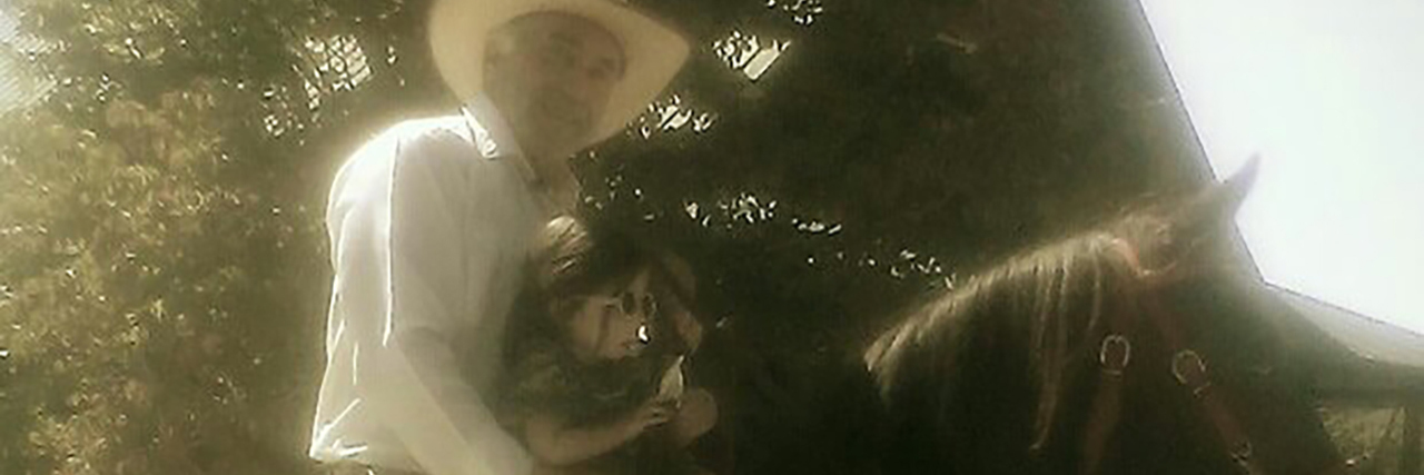 My Father's Gift to His Granddaughter With a Disability Julia Trecanao's father with her daughter, riding a horse.