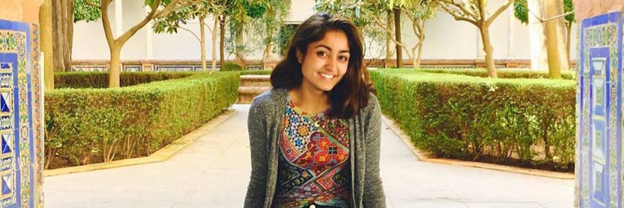 What It's Like to Live With Celiac Disease and Depression woman sitting outside and smiling