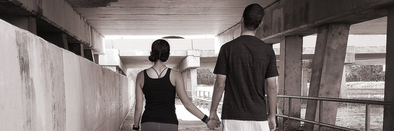How My Husband Has Supported Me 'in Sickness and in Health' man and woman walking together and holding hands