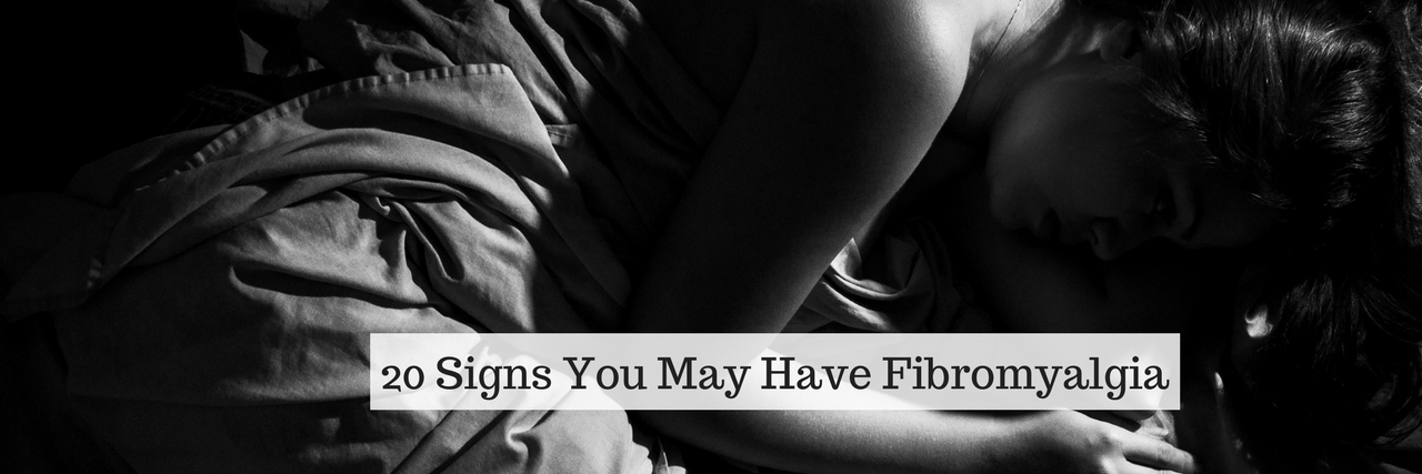 woman laying in bed, black and white image, with text 20 Signs You May Have Fibromyalgia