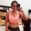 woman taking a photo of herself after working out