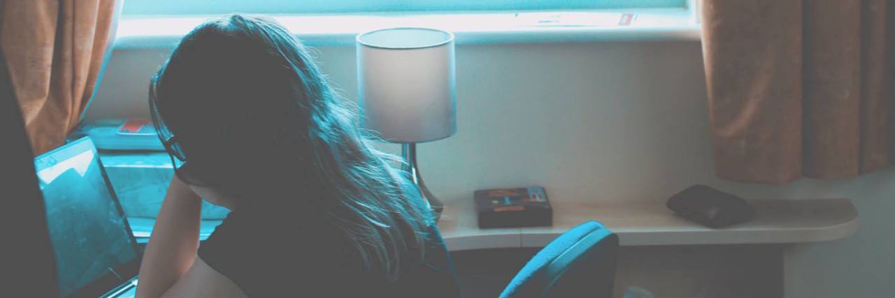 Taking Mental Health Leave From University Is OK girl in dorm room studying at her deak