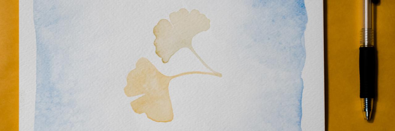 What It Was Like Writing to My Organ Donor's Family A hand painted card and a pen.