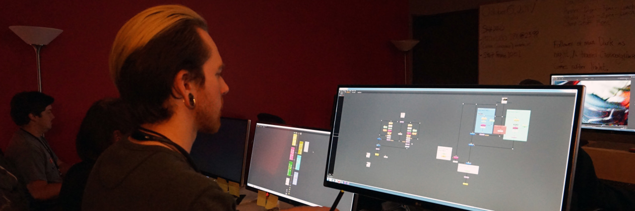 Autistic Visual Effects Artists Work on 'The Good Doctor,' 'Atypical' Side view of Andrew Dugan working on his computer