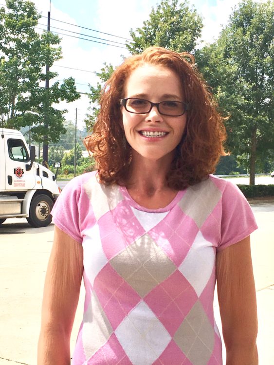 woman standing outside smiling