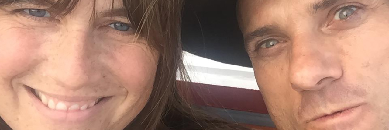 My Mental Health as a Caregiver for My DID Husband woman and man with woman smiling at camera and man wearing hat pulling face