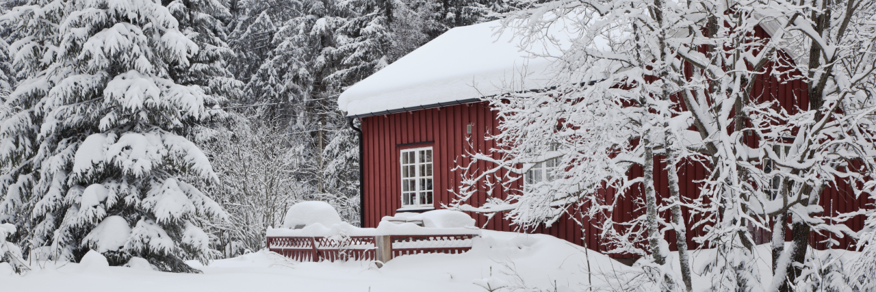 Regaining My Humanity After a Traumatic Brain Injury Charming red house with snow on the roof in winter.