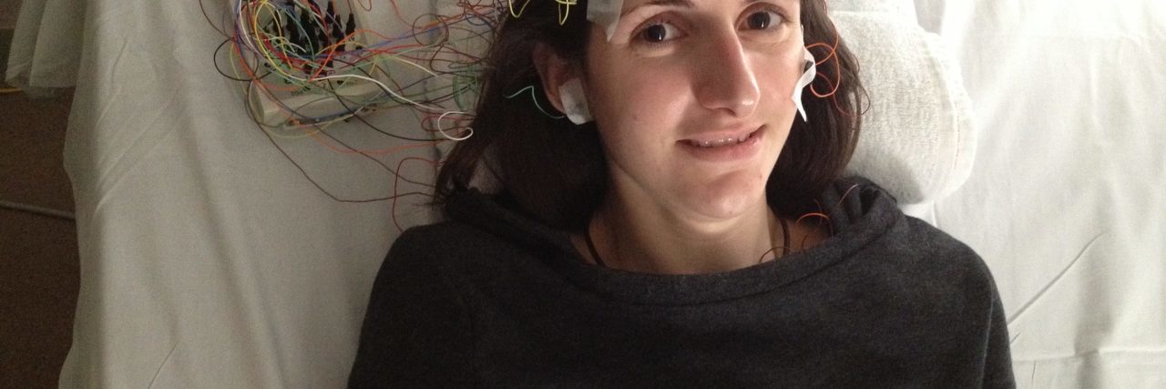 michaela oconnor at doctors appointment with wires on her head