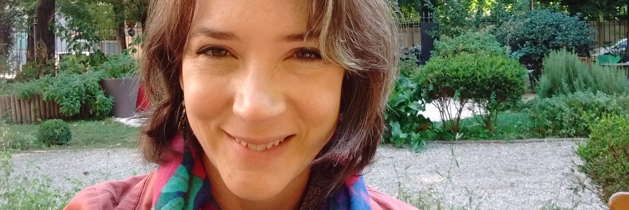Embracing My Gray Hair After My Autoimmune Disease Health Crisis woman smiling outside