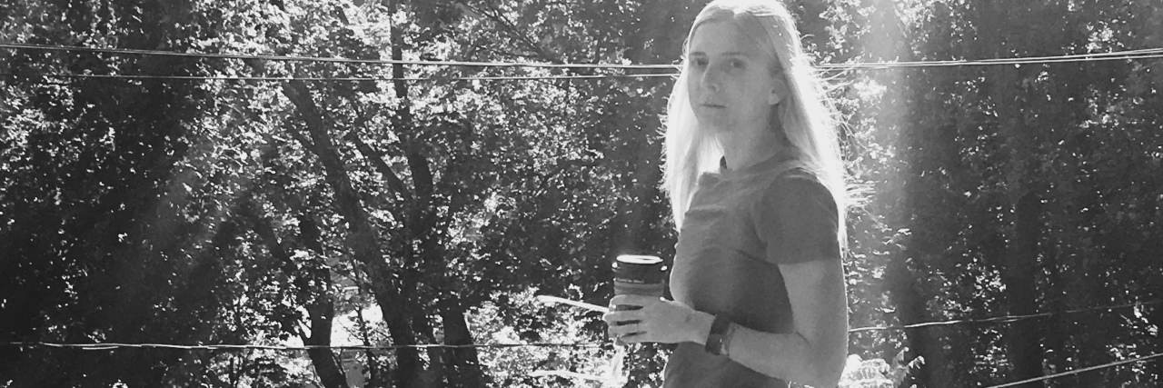 Lyme Disease: When You're in Between Being Chronically Ill and Healthy black and white photo of a woman standing outside holding coffee
