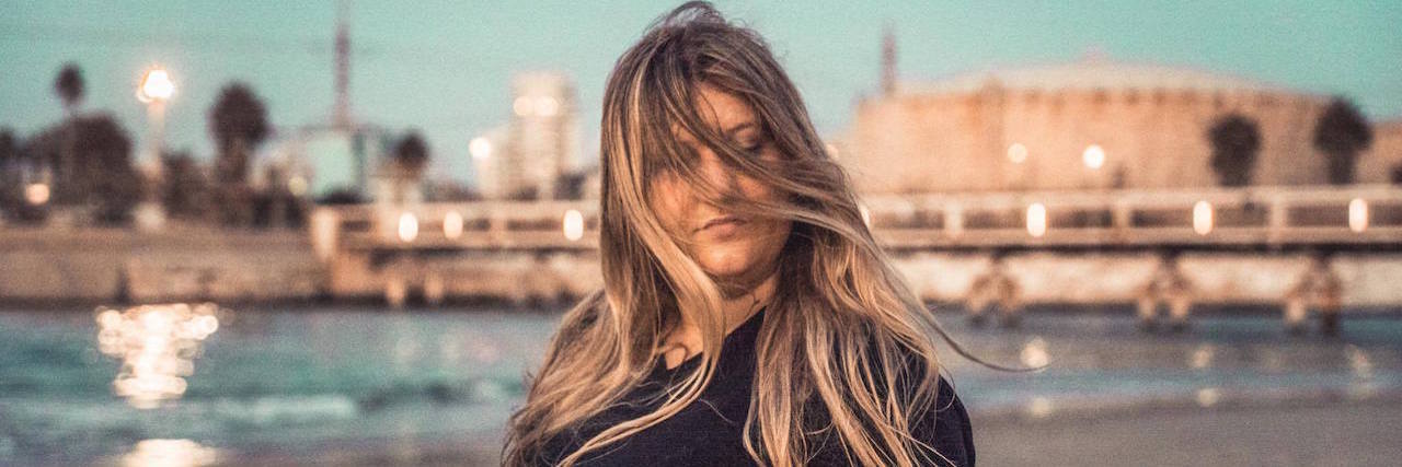 The Difference Between Childhood OCD and OCD as an Adult A woman on the beach