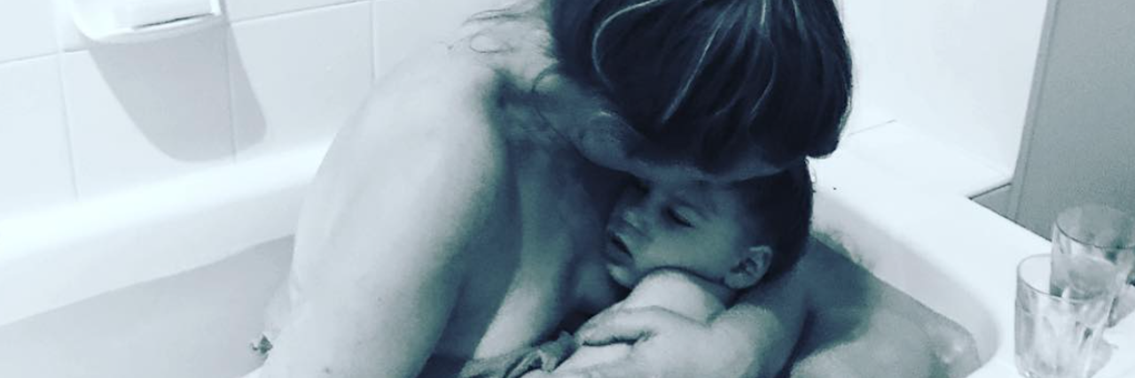 Love Over Fear: Caring for My Child in the Middle of the Night Mother holding child inside a tub