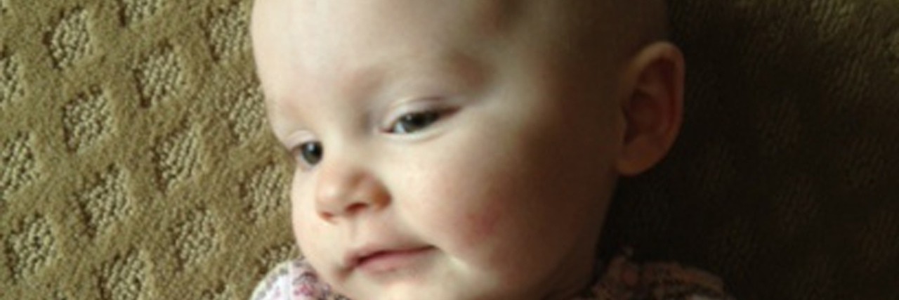 On Missing My Daughter, but Finally Being at Peace Olivia Caldwell laying in floor