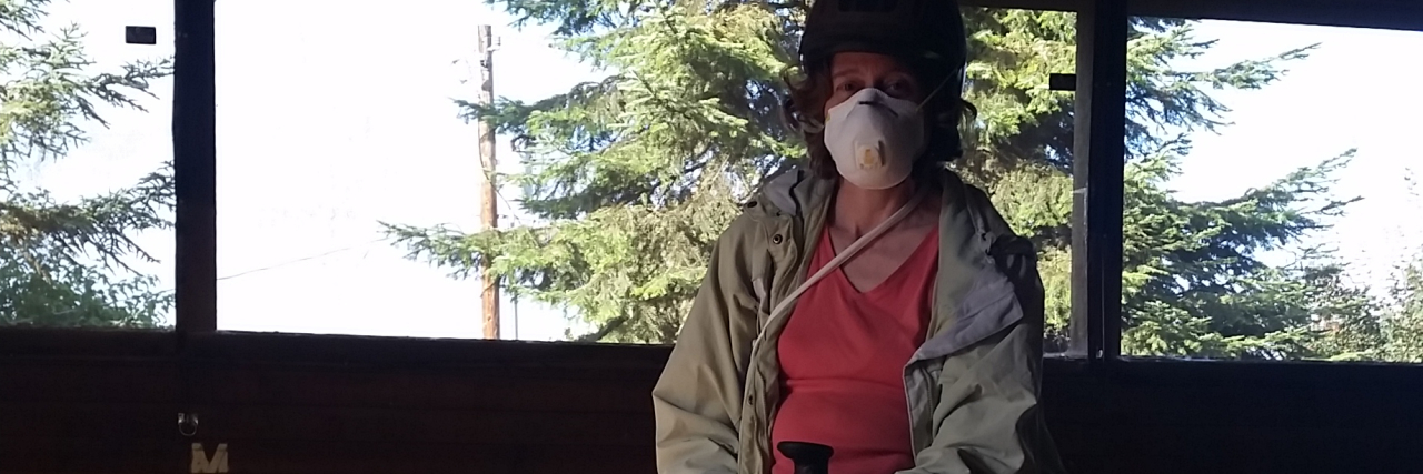 Wearing a Face Mask to Ride Horses Due to Asthma and Cystic Fibrosis woman sitting on a horse and wearing a face mask