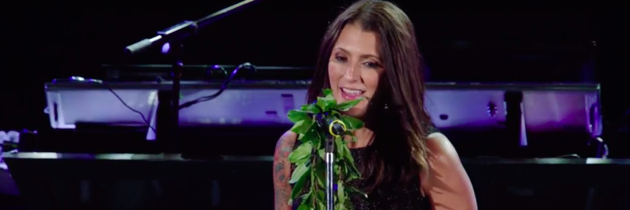 Talinda Bennington Announces New Mental Health Initiative in Honor of Chester Bennington Talinda Bennington speaking on stage.