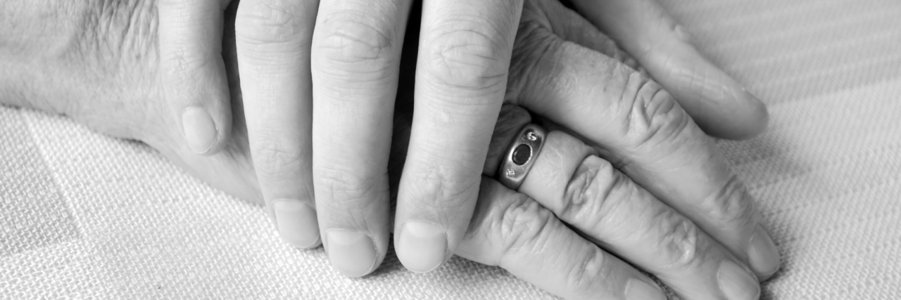 To the Man Who Helped Me Find Purpose Beyond Mental Illness young hand on top of old person's hand in black and white