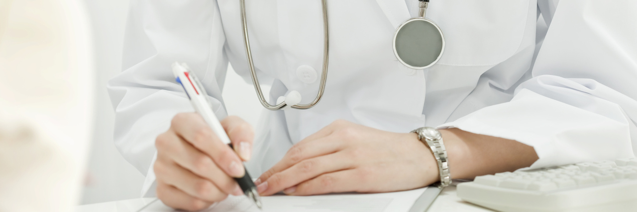Rare Disease Patients Deserve Respect and Understanding From Doctors doctor writing on a medical chart