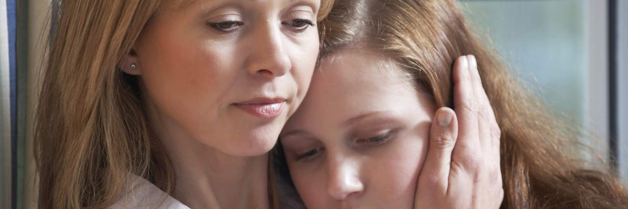 How to Be Proactive in Our Conversations About Suicide mother comforting sad daughter through struggle