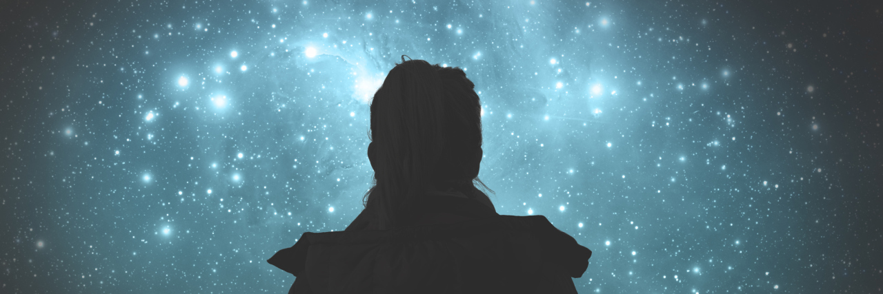 Finding Light in the Darkness of Lyme Disease woman looking at starry night sky