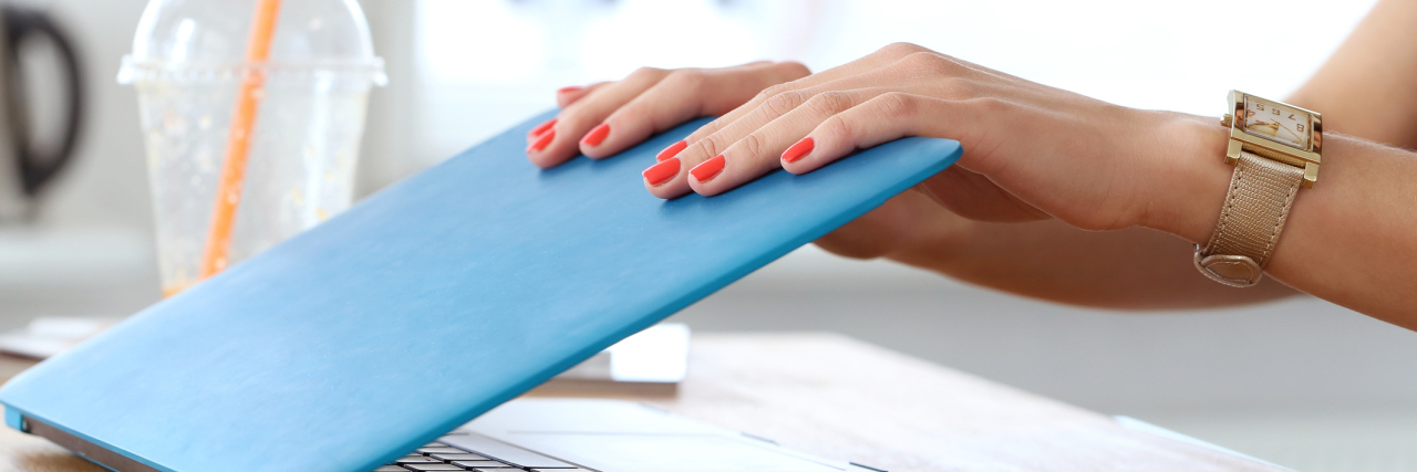 Taking a Break From Online Chronic Illness Support Groups, Blogs woman closing her laptop