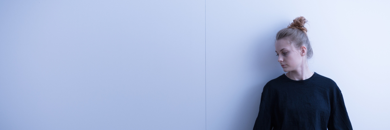 4 Ways to Reclaim Your True Self in the Face of Mental Illness Picture of a sad teenage girl suffering from loneliness