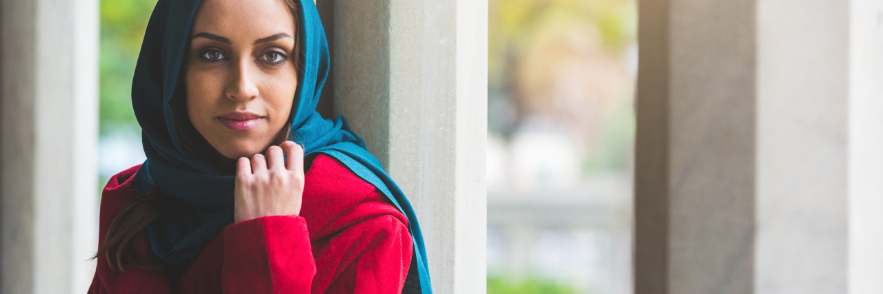 Thinking Positively Will Not Affect My Chronic Pain woman standing outside and looking at the camera