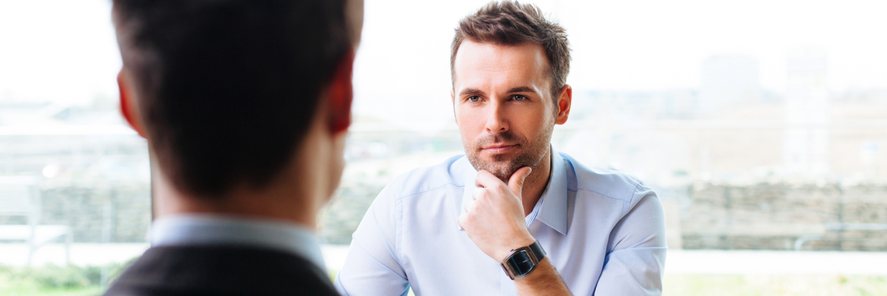 Looking for Work With a Disability Manager and a candidate in a job interview.