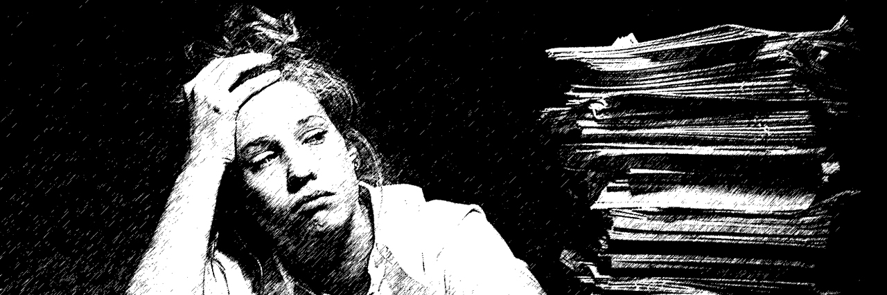 Why Being Disabled Is a Full-Time Job for Many People Woman overwhelmed by stack of papers.