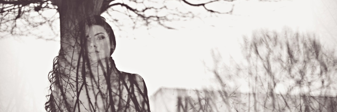 Experiencing a Severe Herx Reaction While in Lyme Disease Recovery double exposure of woman and tree branches