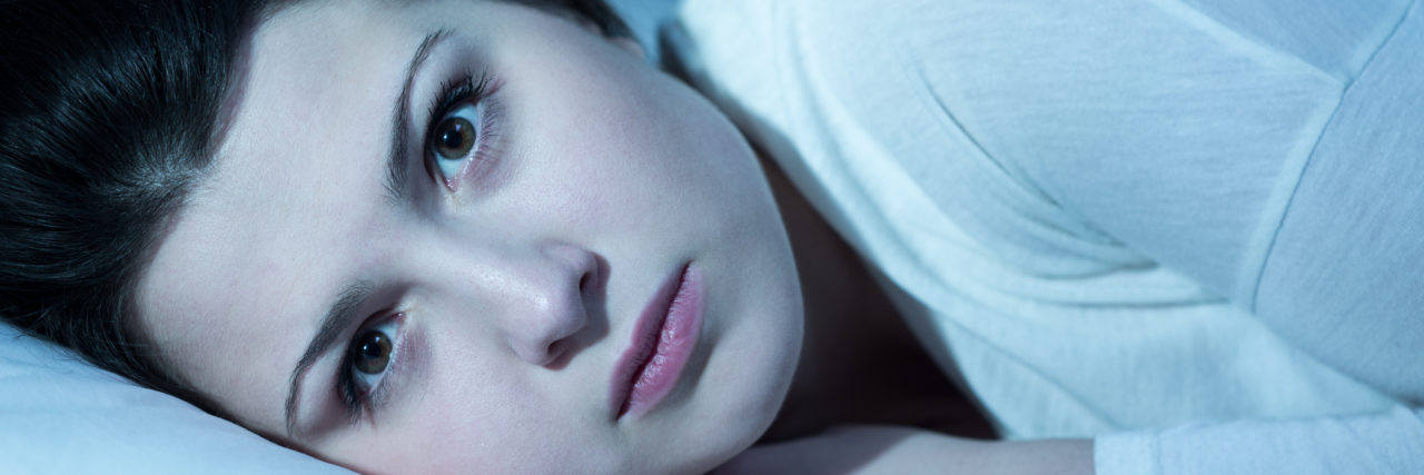 To Get Up, or Not to Get Up — The Battle I Face Every Day Young woman is thinking about something in the night