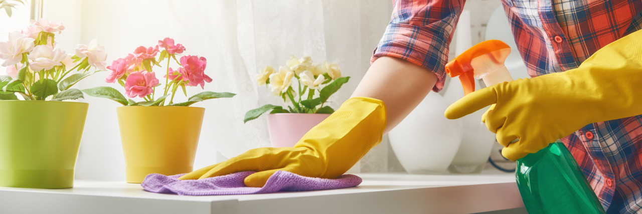 Pacing Yourself With Chronic Illness woman cleaning a table in her home