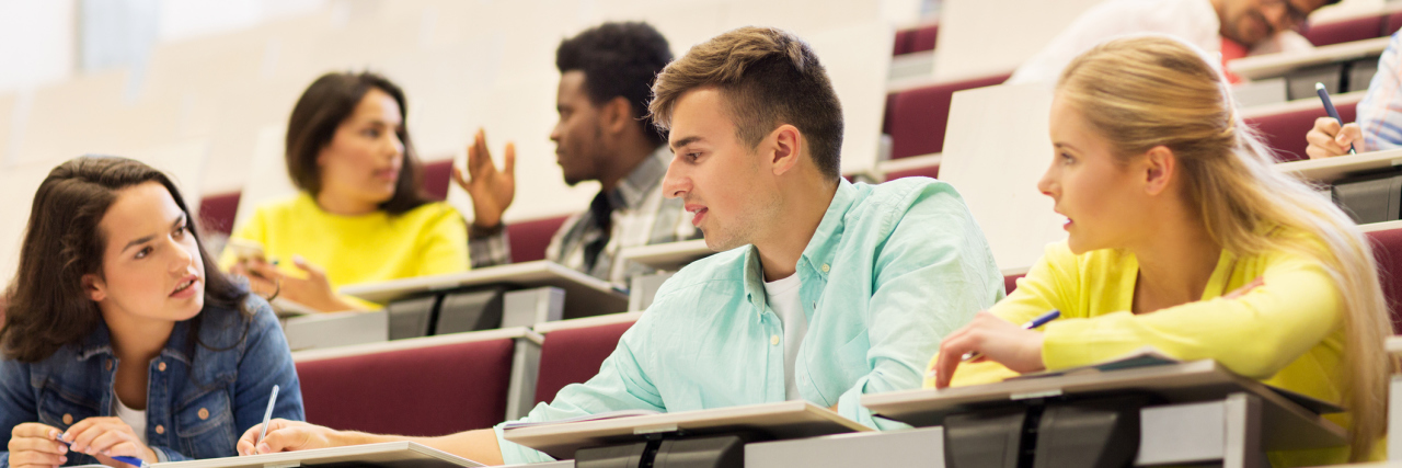 students talking in a classroom