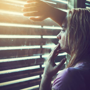 A woman looking out a window