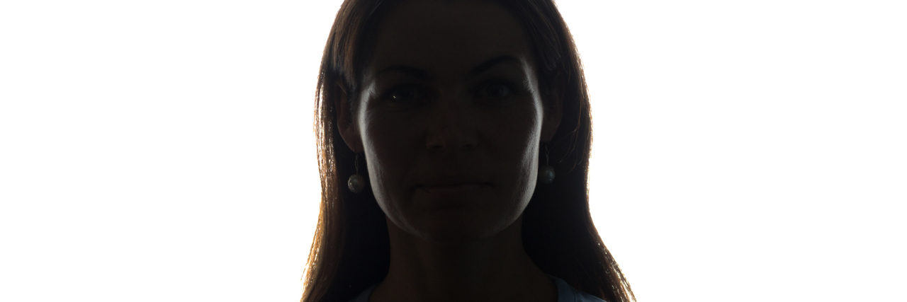 Why You Should Never Say Suicide Is Selfish Young woman look ahead with flowing hair - horizontal silhouette of a front view