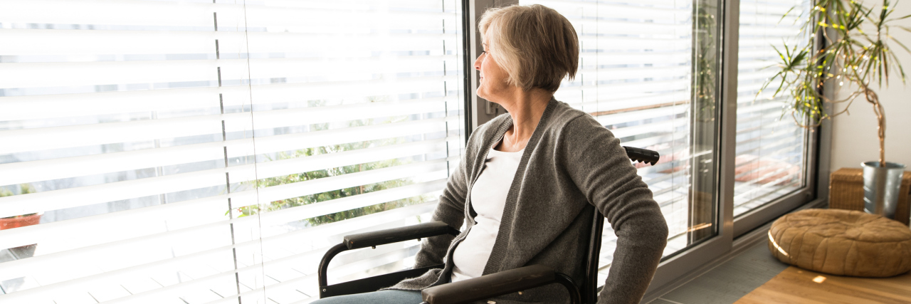 Dercum's Disease: How to React to a Friend Becoming a Wheelchair User woman in a wheelchair in her living room
