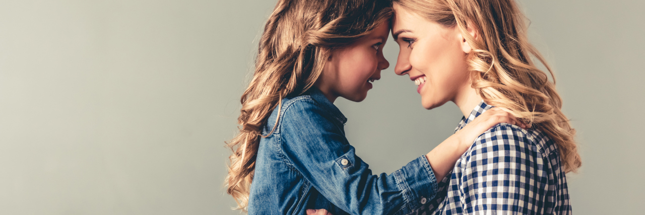 Why Parents With Chronic Illness Shouldn't Feel Guilty or Worried mother and daughter smiling at each other