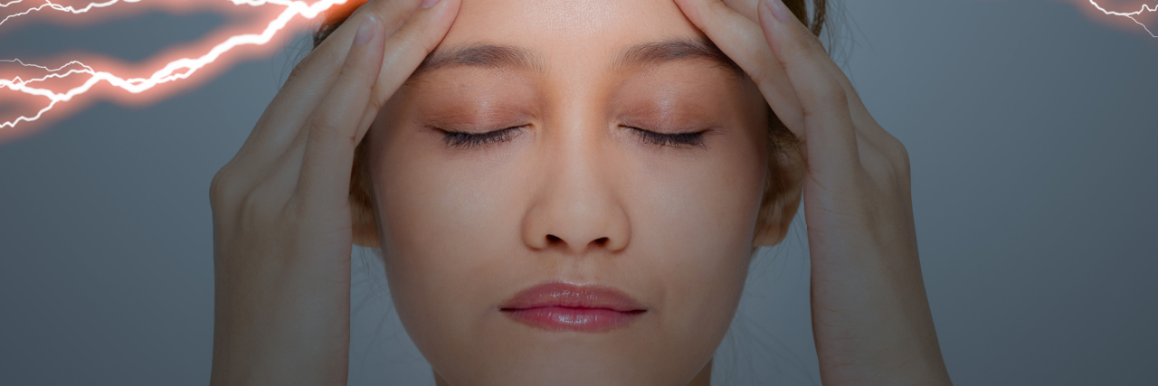 What Triggers My Migraines as Someone With Traumatic Brain Injury woman experiencing a migraine